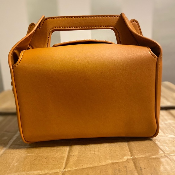 Two different styles of bags tan togo bag and black onyx cube bag - Picture 2 of 7